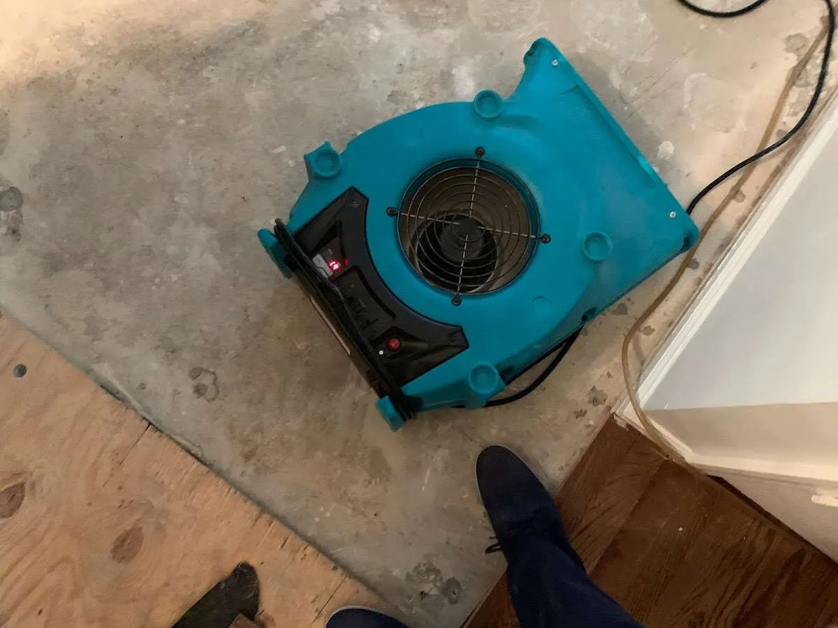 Air mover drying subfloor during Commercial Water Damage Restoration in Glen Ellyn
